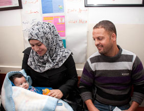 A young family awaits the pneumococcal vaccination at a clinic in Bethlehem. Every infant in the West Bank and Gaza will now receive this life-saving vaccine